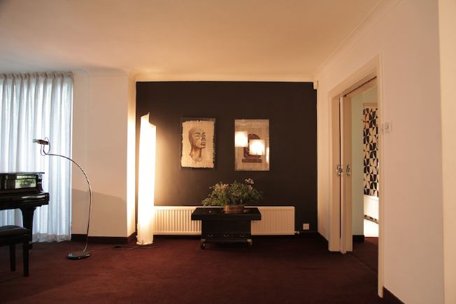 L shaped sitting room of amazing, retro house.  All original 70's furniture.