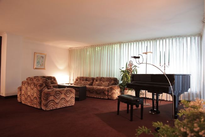 L shaped sitting room of amazing, retro house.  All original 70's furniture.