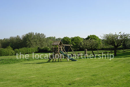 A large country house with 9 acre rural surroundings with private driveway, forecourt and tennis court.