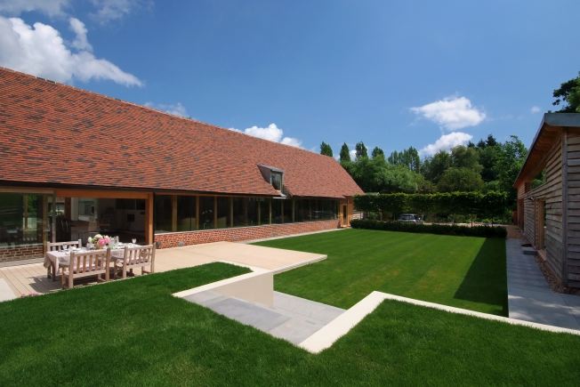 Absolutely stunning contemporary garden of a stylish modern barn conversion