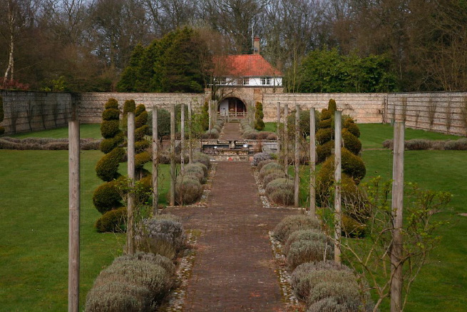 Large formal gardens, outbuildings and woodland at an amazingly eclectic country house.