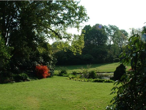 Twenty six acres of woodland garden with greenhouses, thatched folly, 2 ponds, sweeping lawns, large disused flint pit and many colourful plants.