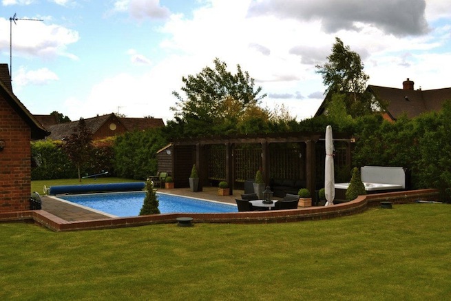 Family swimming pool with adjoining spa with a beautiful view of countryside.