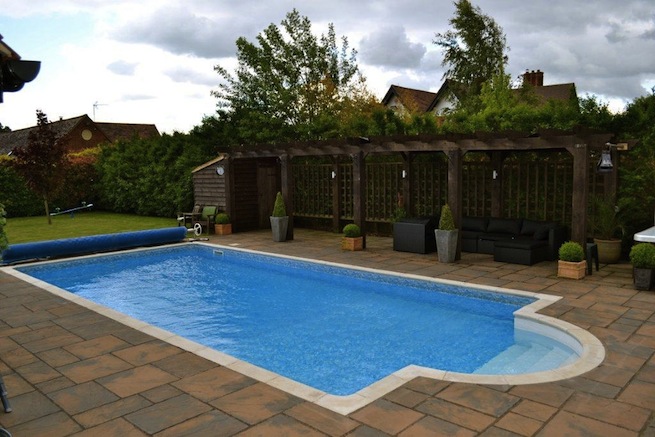 Family swimming pool with adjoining spa with a beautiful view of countryside.