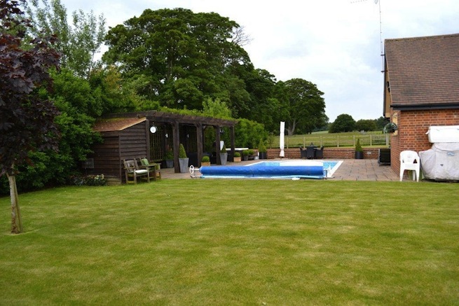 Family swimming pool with adjoining spa with a beautiful view of countryside.