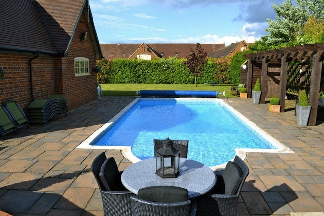 Family swimming pool with adjoining spa with a beautiful view of countryside.