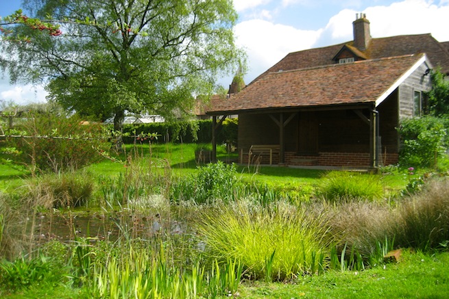 Amazing medieval hall house with beautiful country gardens, featuring vegetable garden and pond.