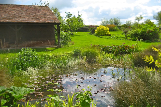 Amazing medieval hall house with beautiful country gardens, featuring vegetable garden and pond.