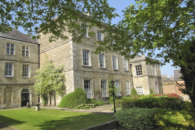 A large 17th century town house in the process of restoration. Some rooms have been done up, each with its own look and some rooms are empty.