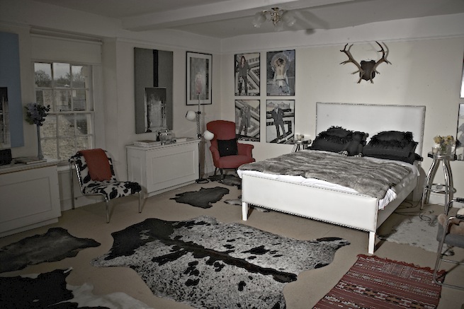 A large 17th century town house in the process of restoration. Some rooms have been done up, each with its own look and some rooms are empty.