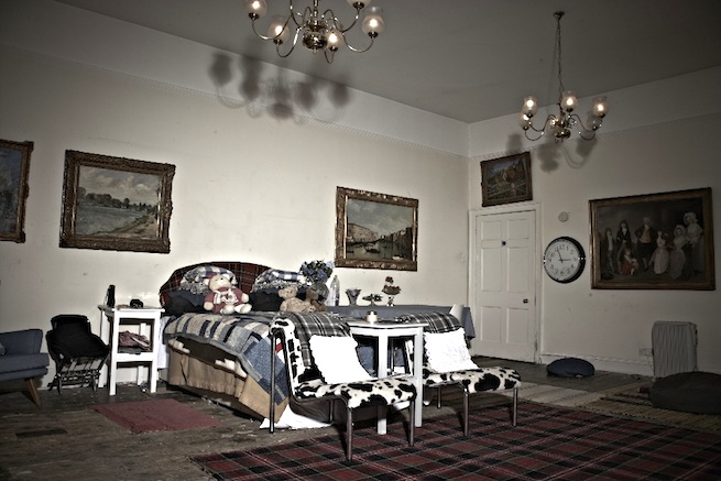 A large 17th century town house in the process of restoration. Some rooms have been done up, each with its own look and some rooms are empty.