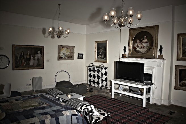 A large 17th century town house in the process of restoration. Some rooms have been done up, each with its own look and some rooms are empty.