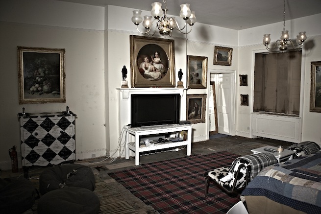A large 17th century town house in the process of restoration. Some rooms have been done up, each with its own look and some rooms are empty.