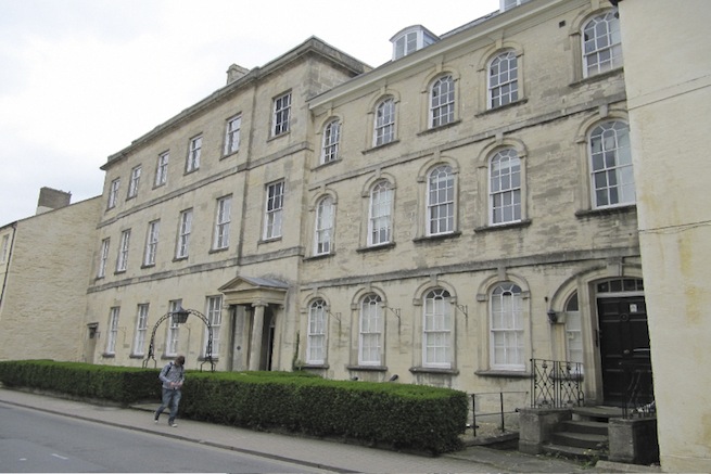 A large 17th century town house in the process of restoration. Some rooms have been done up, each with its own look and some rooms are empty.