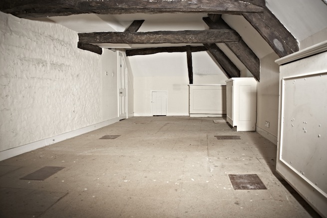 A large 17th century town house in the process of restoration. Some rooms have been done up, each with its own look and some rooms are empty.