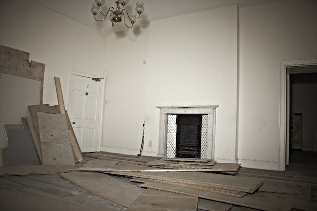 A large 17th century town house in the process of restoration. Some rooms have been done up, each with its own look and some rooms are empty.