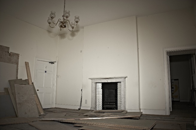 A large 17th century town house in the process of restoration. Some rooms have been done up, each with its own look and some rooms are empty.