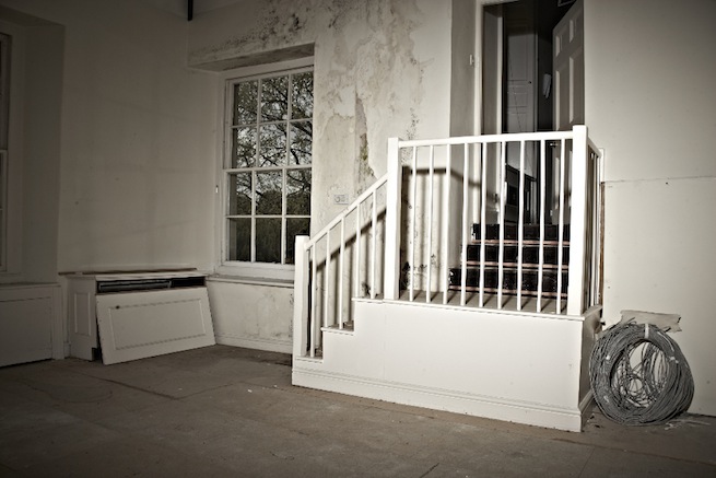 A large 17th century town house in the process of restoration. Some rooms have been done up, each with its own look and some rooms are empty.