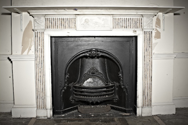 A large 17th century town house in the process of restoration. Some rooms have been done up, each with its own look and some rooms are empty.