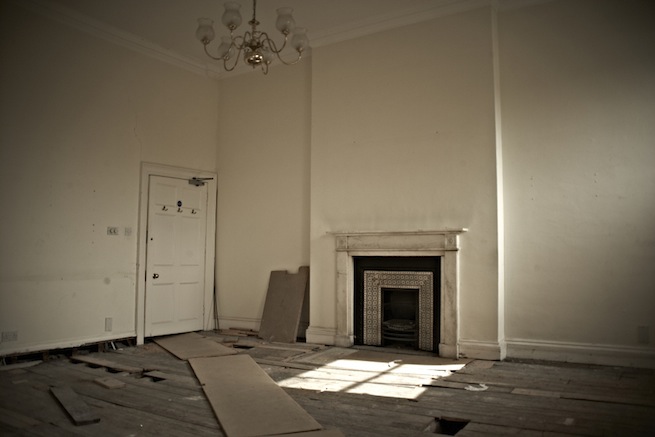 A large 17th century town house in the process of restoration. Some rooms have been done up, each with its own look and some rooms are empty.