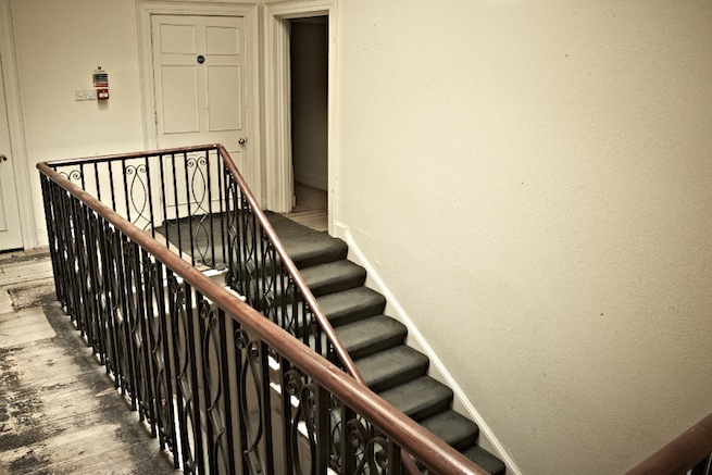 A large 17th century town house in the process of restoration. Some rooms have been done up, each with its own look and some rooms are empty.