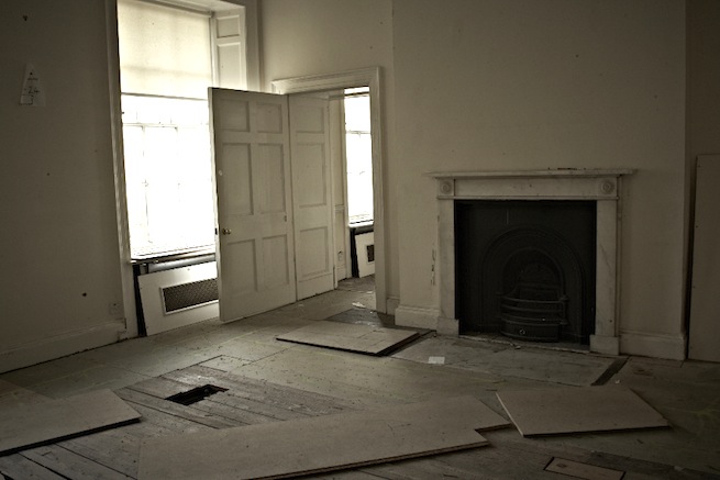 A large 17th century town house in the process of restoration. Some rooms have been done up, each with its own look and some rooms are empty.
