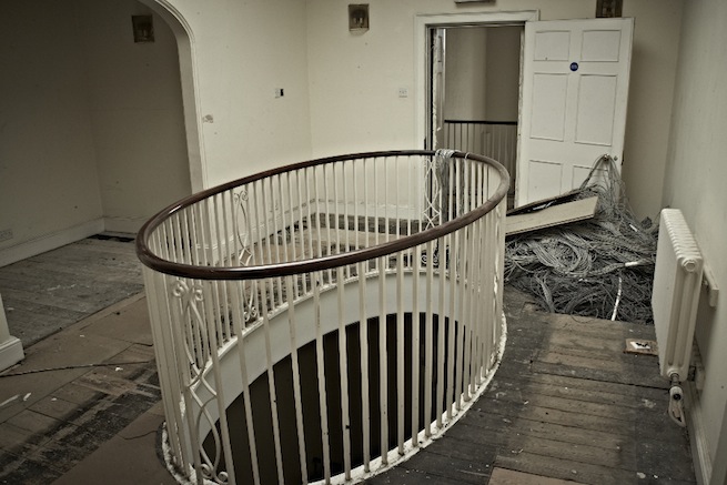 A large 17th century town house in the process of restoration. Some rooms have been done up, each with its own look and some rooms are empty.