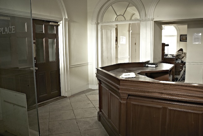 A large 17th century town house in the process of restoration. Some rooms have been done up, each with its own look and some rooms are empty.