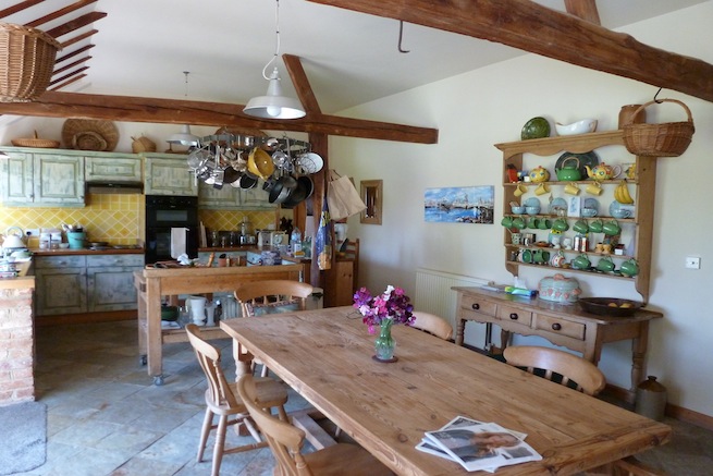 Large converted twin kiln oast with attached converted barn and stables. Large rooms with beams, eclectic decor in old french farmhouse style. Large garden and paddocks.