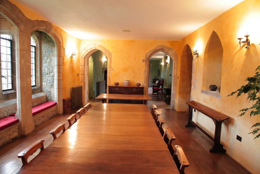 Period dining room with stone mullion windows in a beautiful castle