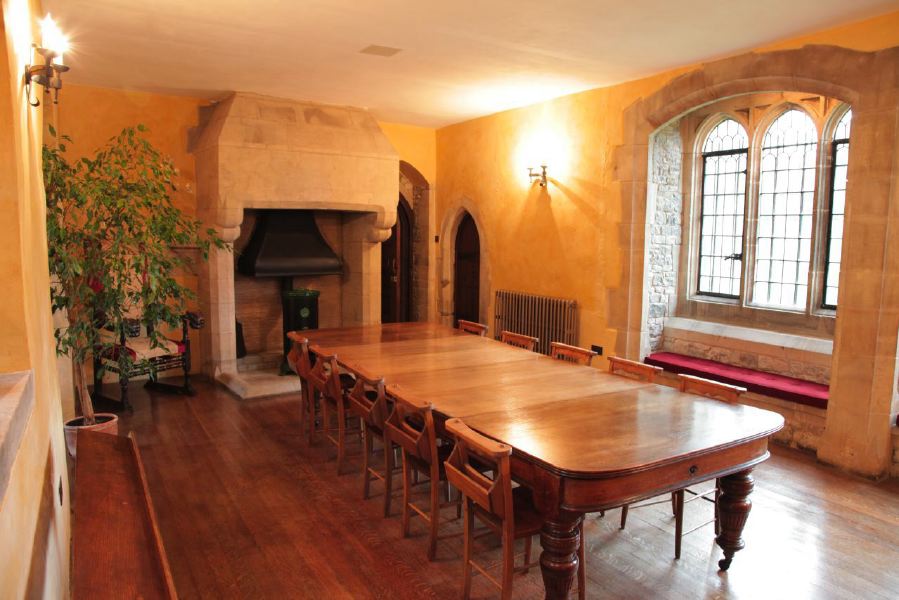 Period dining room with stone mullion windows in a beautiful castle