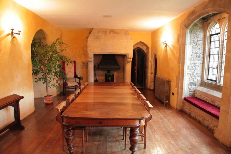 Period dining room with stone mullion windows in a beautiful castle