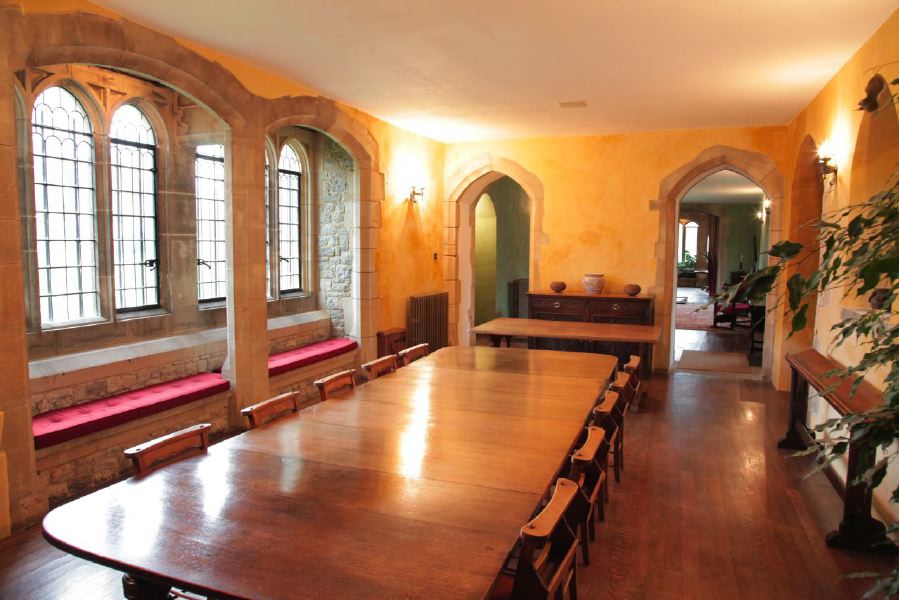 Period dining room with stone mullion windows in a beautiful castle