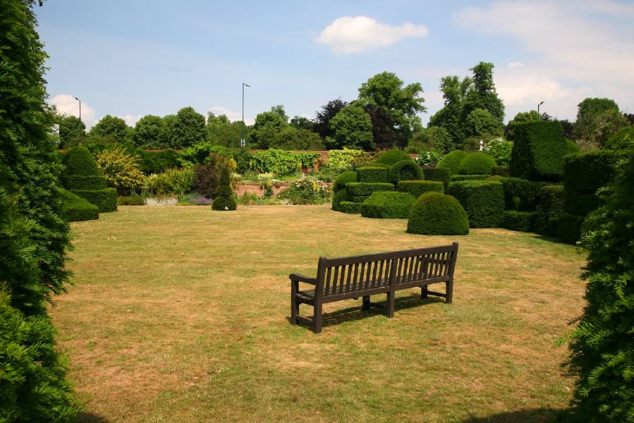 Topiary gardens, rose gardens, formal gardens and parkland around a Medieval Manor House