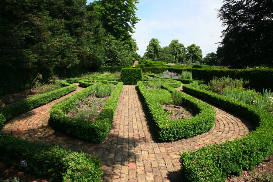 Topiary gardens, rose gardens, formal gardens and parkland around a Medieval Manor House