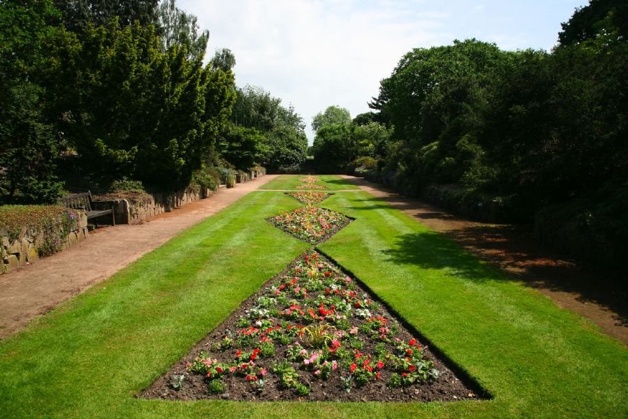 Topiary gardens, rose gardens, formal gardens and parkland around a Medieval Manor House