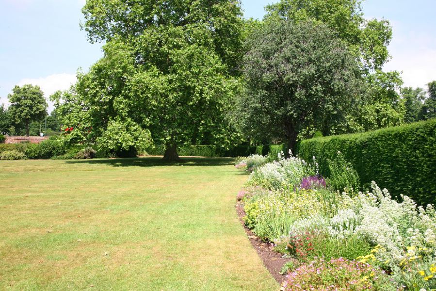Topiary gardens, rose gardens, formal gardens and parkland around a Medieval Manor House