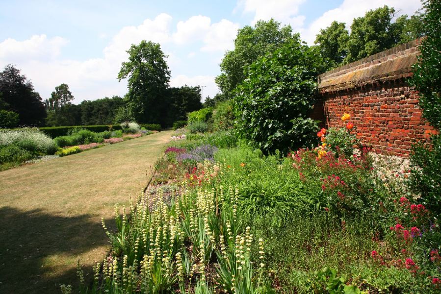 Topiary gardens, rose gardens, formal gardens and parkland around a Medieval Manor House