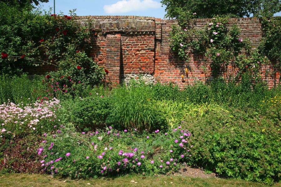 Topiary gardens, rose gardens, formal gardens and parkland around a Medieval Manor House