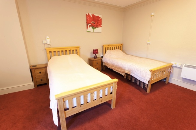 Converted Jacobean house with many bedrooms, 87 beds in total.