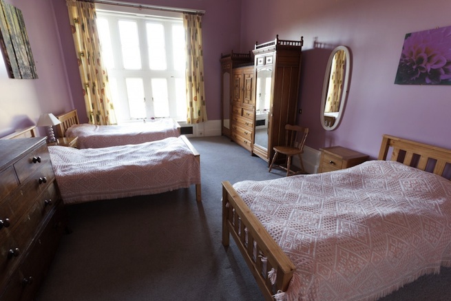 Converted Jacobean house with many bedrooms, 87 beds in total.