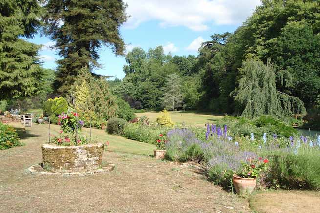 Heritage garden in large country estate featuring a Doric temple, Gothic boathouse, lakes and caves.