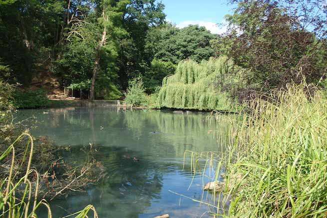 Heritage garden in large country estate featuring a Doric temple, Gothic boathouse, lakes and caves.