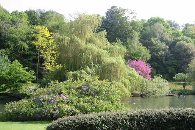 Heritage garden in large country estate featuring a Doric temple, Gothic boathouse, lakes and caves.