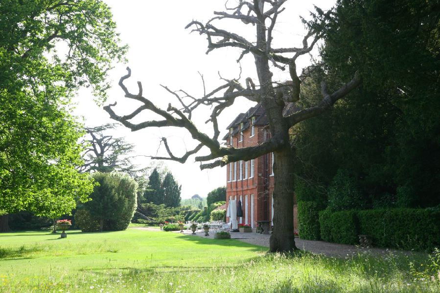 York stone patio along the front of a pretty country house