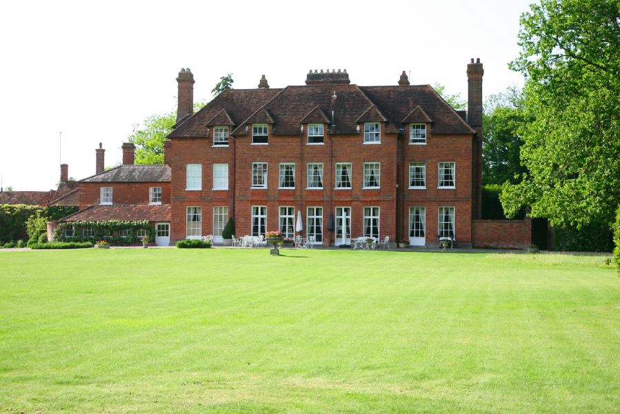York stone patio along the front of a pretty country house