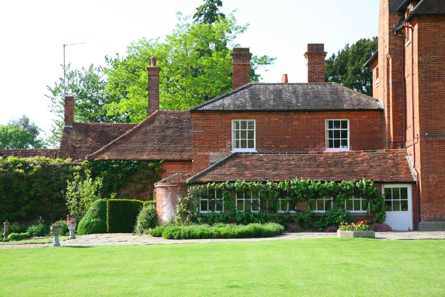 York stone patio along the front of a pretty country house
