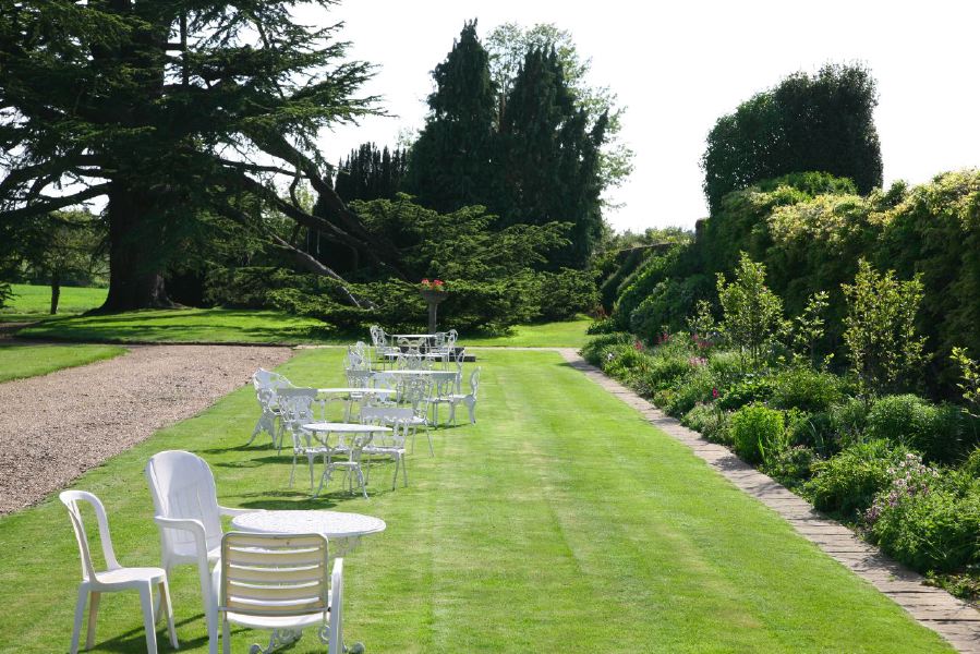 York stone patio along the front of a pretty country house