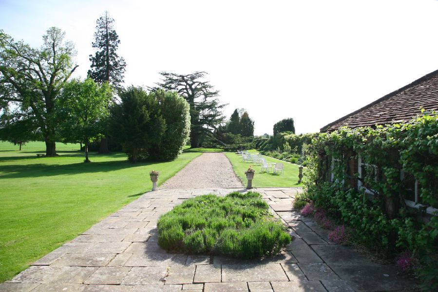 York stone patio along the front of a pretty country house