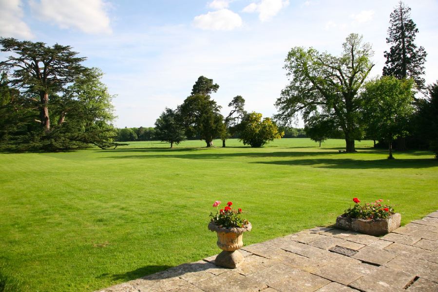 York stone patio along the front of a pretty country house